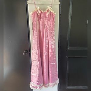 Shiny pink Sister Jane maxi dress with bows. Size small. Brand new with tags.